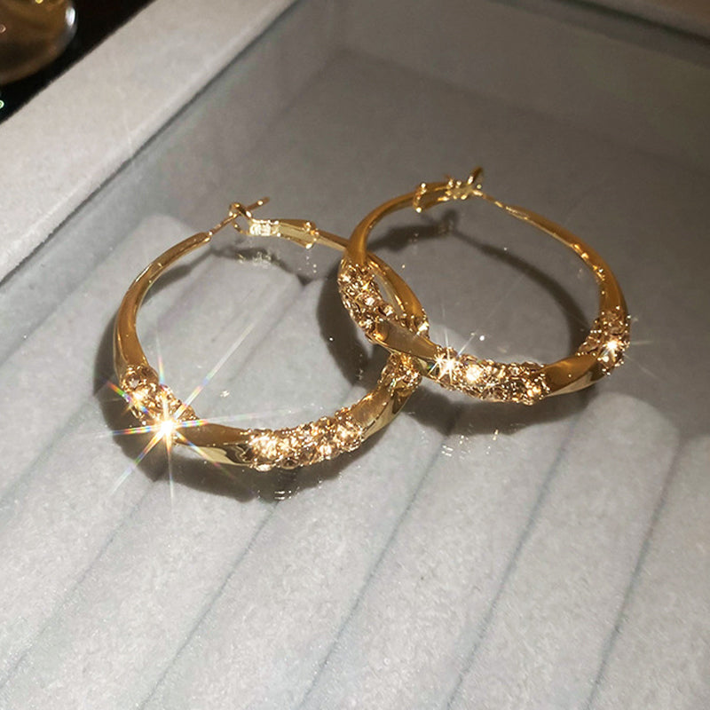 Brincos redondos com zircônias